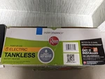 Rheem RETEX04 Electric Tankless Water Heater - Gray Open. Price: $129.00.